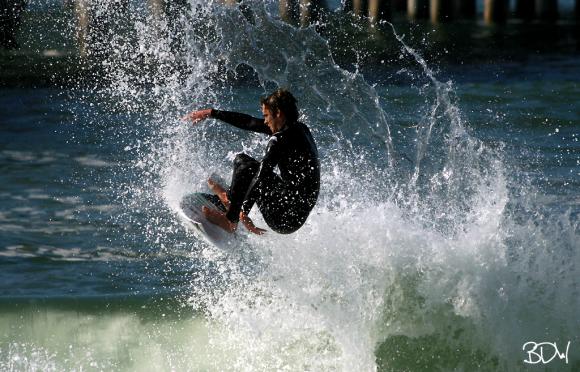 Surfing at Huntington Beach Pier