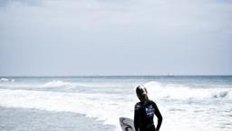 Stephanie Gilmore in the shorebreak