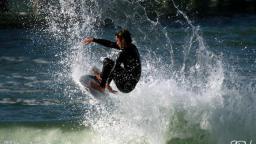 Surfing at Huntington Beach Pier