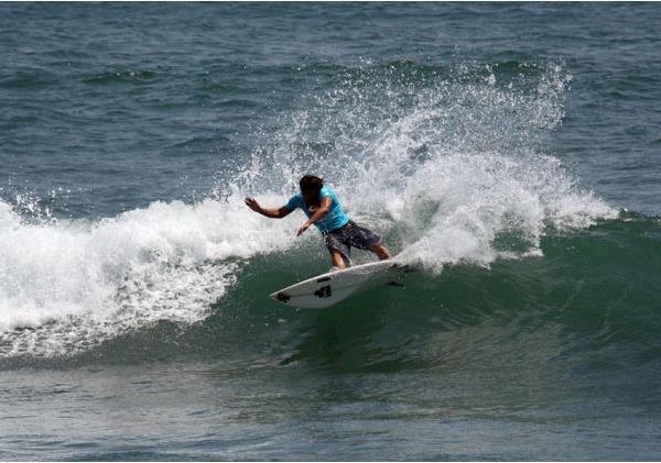 Kalani Robb on a small wave