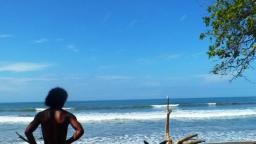 Rony Obando (www.surfschoolpuravida.com) checking the waves at playa Dominicalito.