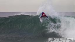 Adrian Buchan Looks down a JBay Face