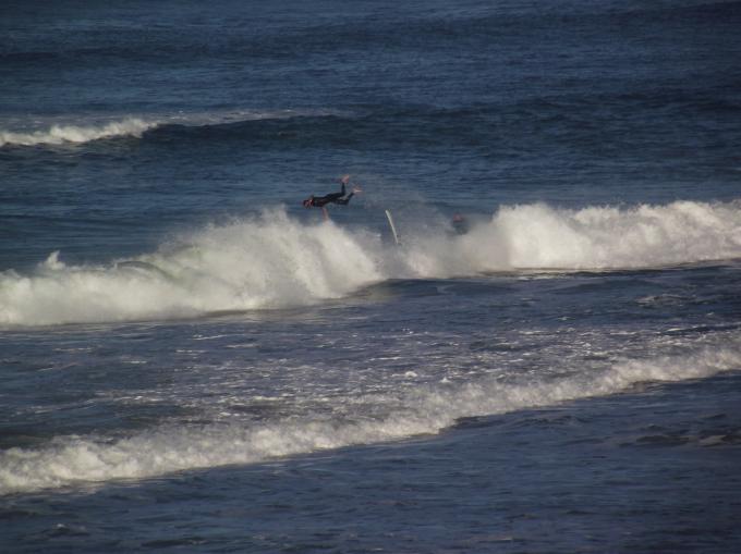 Surfer Takes A Dive