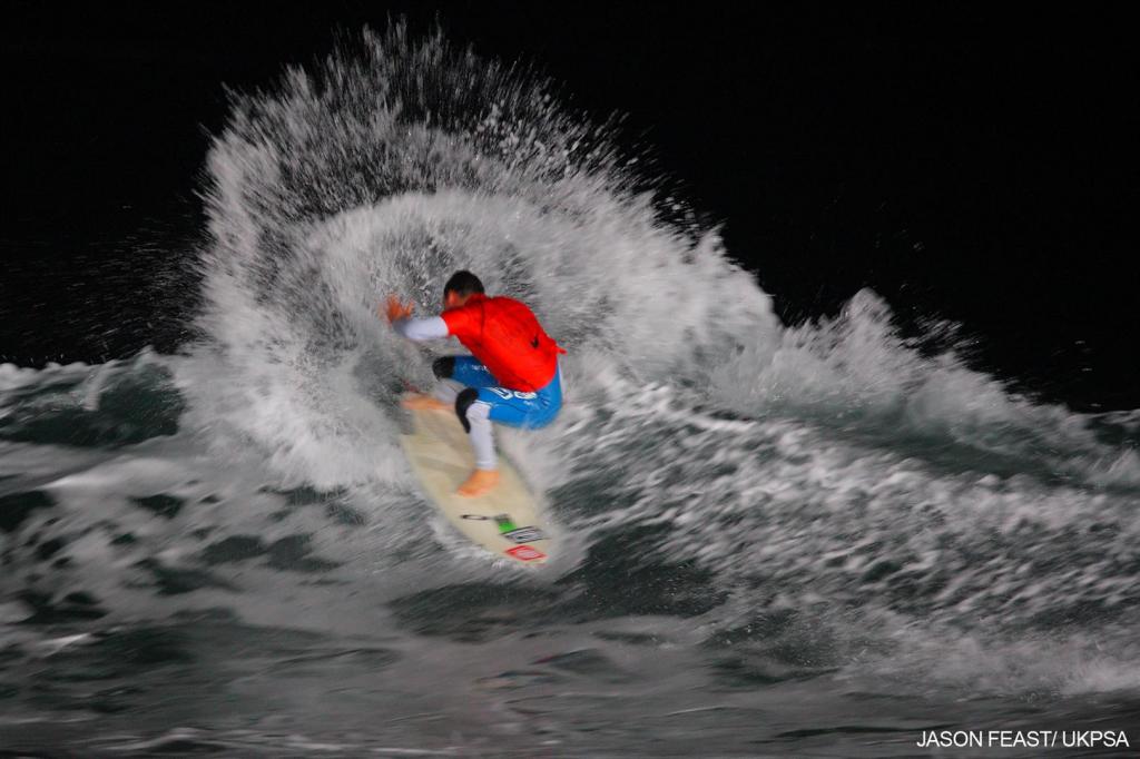 Russell Winter surfing at night