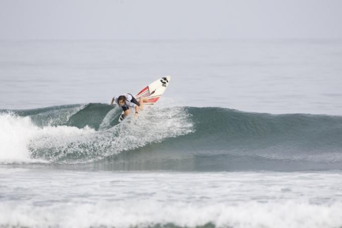 Rebecca Woods surfing in small waves