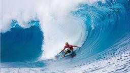 Kelly surfs Teahupoo 