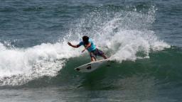 Kalani Robb on a small wave