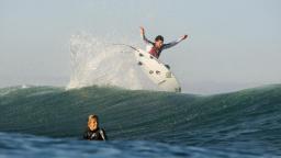 Andy Irons behind the wave