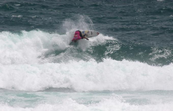 Wade Carmichell in the small surf at Piha