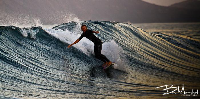 surfing harbour wall with Island Boarders surf school