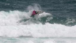 Wade Carmichell in the small surf at Piha