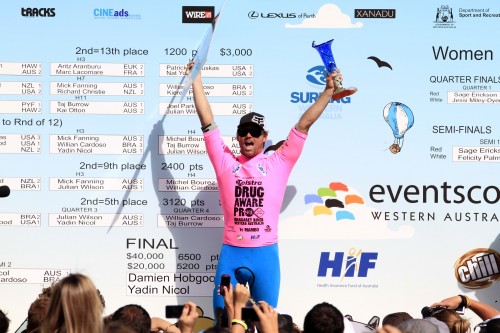 Damien Hobgood holds up the trophy