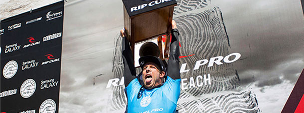 Mick Fanning Holds the Bells Trophy Aloft
