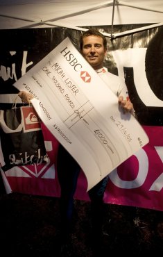 Micah Lester Holding the Winners Cheque